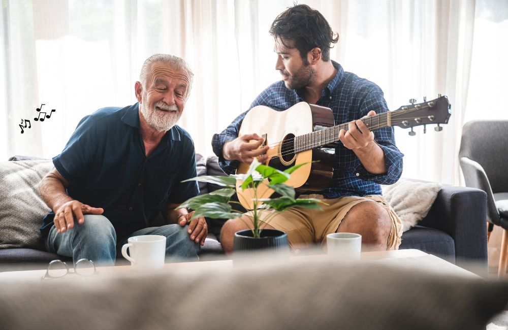 creative arts and music can help with neurological memory disorders, as shown by a grandfather listening to a young adult play guitar